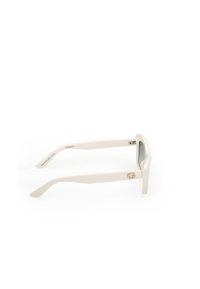 White sunglasses with a square frame, thick arms, subtle logo detail, and gray lenses. Smooth texture with a modern design.