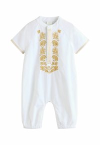 Romper en coton blanc à manches courtes, avec un riche broderie dorée sur le devant et un ourlet bas froncé pour un ajustement cintré.