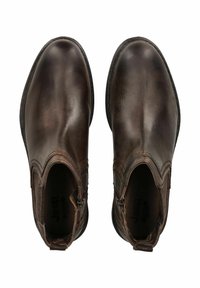 Botines de cuero marrón con un acabado suave, paneles laterales elásticos y una punta ligeramente afilada. Diseñados con cremalleras en el interior.