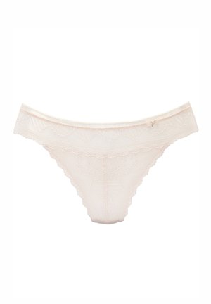 Delicate light beige lace thong with scalloped edges and a small decorative bow on the waistband against a white background.