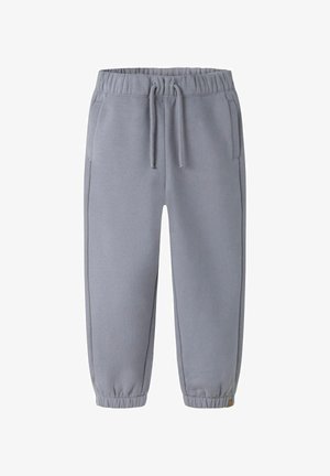 Jasnoszare spodnie dresowe z miękkiego materiału, charakteryzujące się elastycznym pasem, bocznymi kieszeniami i zwężanymi mankietami dla lepszego dopasowania.