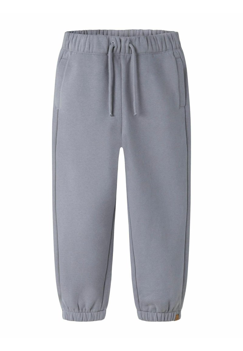 Lys grå sweatpants lavet af blødt stof, med elastisk talje, sidelommer og tætsiddende stolper for en snug pasform.