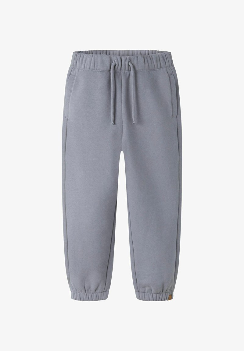 Lys grå sweatpants lavet af blødt stof, med elastisk talje, sidelommer og tætsiddende stolper for en snug pasform.