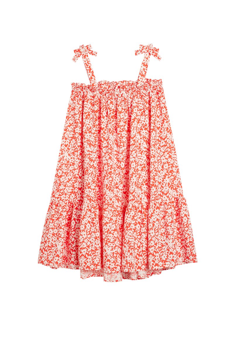 Rød og hvid blomsterkjole uden ærmer med elastisk bodice, flæselag og sløjfebånd på skulderstropperne. 100% bomuldsstof.