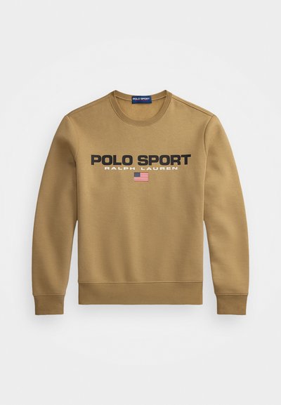 Svetlo rjav sweatshirt z bold črnim napisom "POLO SPORT" in "RALPH LAUREN", pod napisom pa je majhna podrobnost ameriške zastave.