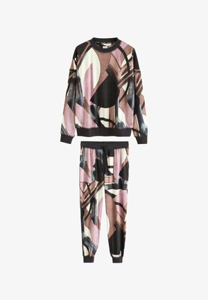 Colorful loungewear set featuring a long-sleeve top and jogger pants. Made from smooth fabric with abstract patterns in pink, black, and cream.
