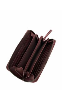 Portefeuille marron avec fermeture éclair, plusieurs emplacements pour cartes et une texture lisse. Il possède un intérieur spacieux avec des coutures discrètes.