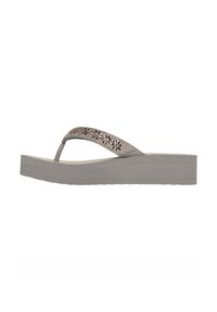 Grijze platform flip-flops met een getextureerde zool, met een decoratieve band versierd met bloemmotieven en kleine steentjes.