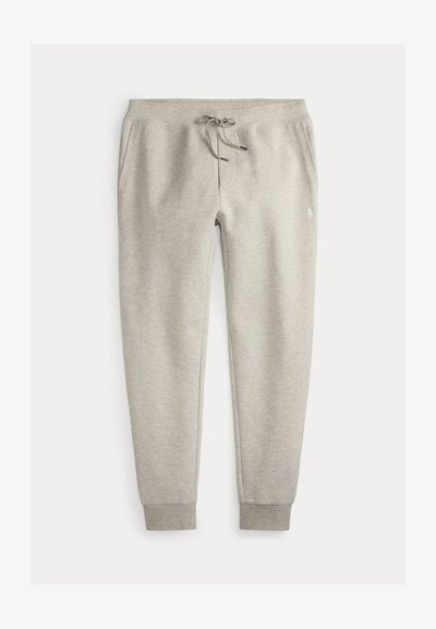 Pantalon de survêtement gris clair avec taille à cordon, poches latérales, poignets côtelés et petit logo brodé sur la cuisse droite.