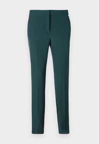 Tamnozelene slim-fit ženske hlače s glatkim pojasom i sprijeda skrivenim kopčanjem, prikazane na bijeloj pozadini.