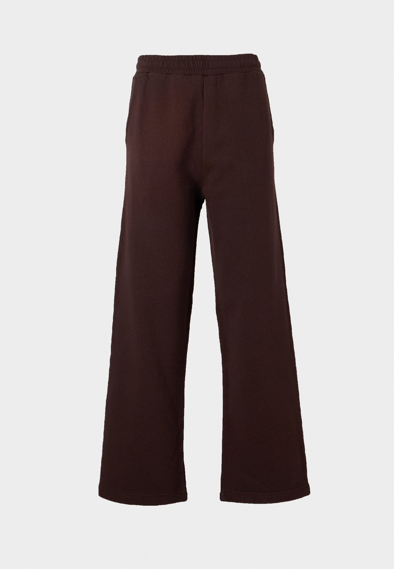 Dunkelbraune weit geschnittene Hose mit elastischem Bund, seitlichen Taschen und geradem Saum vor schlichtem, hellem Hintergrund.