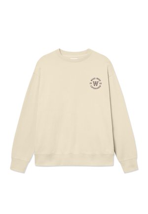 Beige sweatshirt lavet af bomuld. Har rund halsudskæring, lange ærmer og et lille grafisk logo på venstre bryst. Glat tekstur.