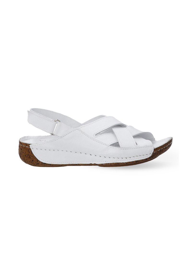 Witte leren slingback sandalen met kruisbanden, een kurken zool en stikdetails langs de rand van de zool. Open teen ontwerp.
