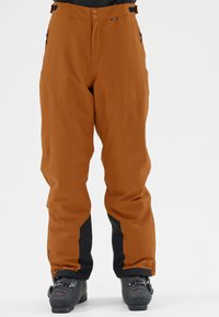 Skibroek, oranje-bruin materiaal, waterafstotend, met zwarte accenten, twee zijzakken en een rechte pijpdesign met verstelbare tailleband.