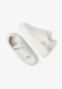 White sneakers with beige accents, textured leather and suede, round toe, lace-up front, and grooved rubber sole. Features brand logo and stitching.
