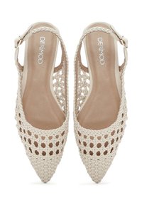 Woven beige slingback shoes with pointed toes and a textured design. Features a thin ankle strap with a buckle for a secure fit.