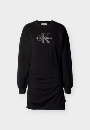 Black sweatshirt dress made of soft fabric, featuring long sleeves, a round neckline, and a front gray logo print with elegant draping at the hem.