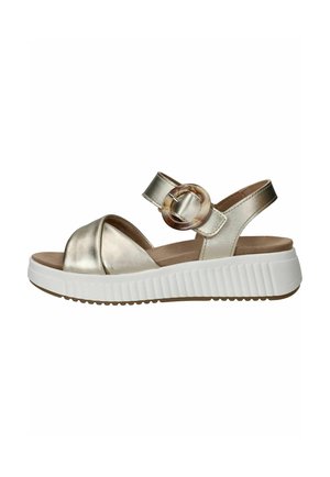 Metallic gouden open teen sandaal met dikke witte geribbelde zool en enkelbandje met een ronde schildpad gesp.
