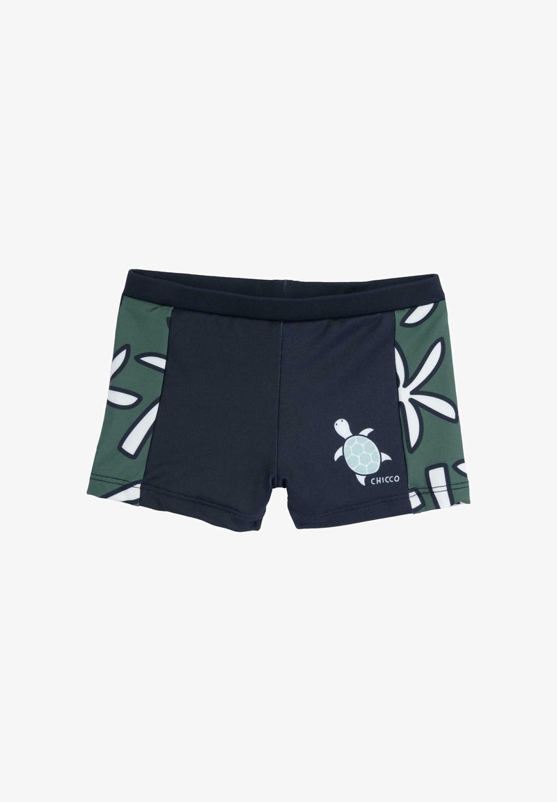 Shorts de bain pour garçons avec un tissu principal bleu marine, un panneau latéral vert orné de motifs de feuilles, et un graphique de tortue sur le devant.