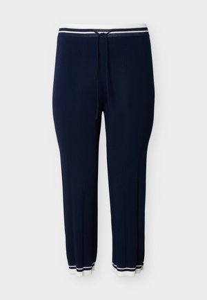 Μπλε σκούρο πλεκτό παντελόνι με λευκή ριμπ έλασμα στη μέση και στα μανσέτα, με κορδόνι και λεπτή κάθετη υφή ριμπ.