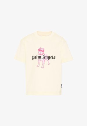 Maglietta color crema con un'illustrazione rosa di un cane che indossa occhiali da sole e la scritta "Palm Angels" in caratteri gotici neri sul petto.