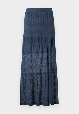 Jupe longue bleu marine en tissu texturé, avec des sections superposées et un motif ondulé, dotée d'une taille élastique pour un ajustement parfait.