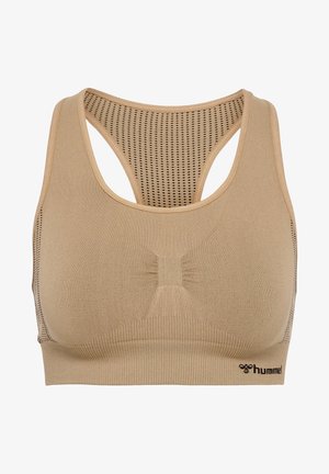 Beige sportbh med mesh racerback, ribbad textur och subtilt veck på framsidan. Hummel-logotyp i svart längst ner.