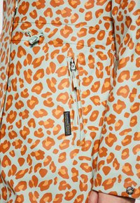 Schmuddelwedda Parka - pastellmint orange leo