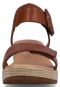 Brown leather sandal with two straps, one adjustable. Textured beige sole with a wood-like appearance. Size 37 marked on insole.