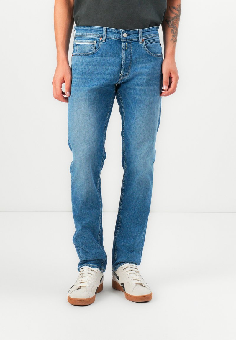 Light blue denim jeans with a straight cut, five-pocket design, and belt loops. Features a zip fly and subtle fading on the fabric.