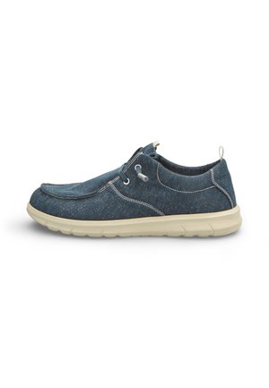 Scarpa casual blu navy senza lacci con cuciture bianche, lacci elasticizzati, suola imbottita beige e linguetta sul tallone per facilitarne la calzata.