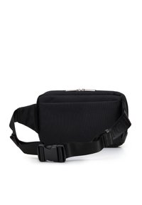 Sac de taille en tissu noir de forme rectangulaire, doté d'un zip en haut, d'une sangle réglable et d'une boucle en plastique. Matériau texturé sans motifs.