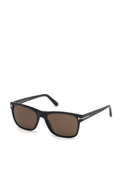 Gafas de sol negras con montura rectangular, lentes marrones y sutiles acentos dorados en las varillas. Fabricadas en plástico con un acabado suave.