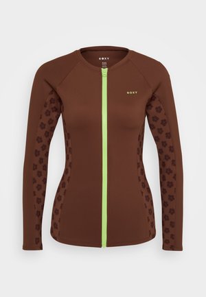 Brauner, langärmliger Rash Guard mit einem Reißverschluss vorne, der grüne Akzente und gemusterte dunkelbraune Blumenmuster an den Seiten aufweist.