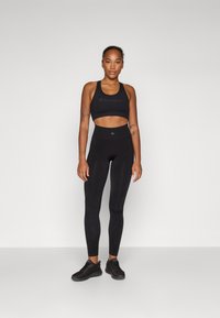Champion SEAMLESS LEGGINGS SHOCK ABSORBER - Tamprės - black
