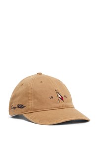 Kanvas baseball caps i beige med buet skygge, som har et broderi med logo, året "1993" og merkevarenavnet på siden.