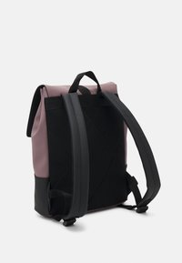 Backpack featuring a pink upper in a smooth material, black mesh straps, and a black base, with a rectangular shape and top handle.