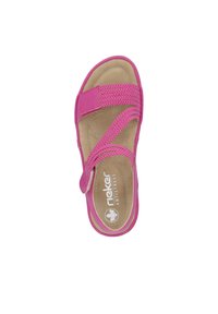 Pink sandal with a textured strap design, adjustable hook-and-loop closure, and a cushioned insole. Flat sole and branded footbed.