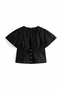 Zwarte katoenen blouse met korte, brede mouwen, een diepe V-hals en decoratieve uitsparingen. Bevat een strikdetail en knoopsluiting aan de voorkant.
