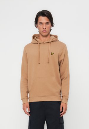 Haut à capuche beige en coton doux avec une poche avant, un cordon de serrage à la capuche et un petit logo brodé jaune sur la poitrine gauche.