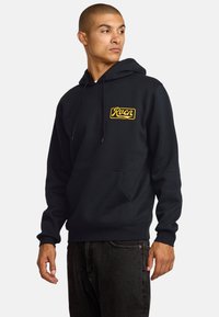Black hooded sweatshirt with a front pocket, featuring a yellow "Rucn" logo on the chest. Soft fabric, long sleeves, and ribbed cuffs.