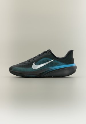 Čierno-tyrkysová bežecká obuv Nike s bielym logom Swoosh a odpruženou podrážkou, zobrazená z profilu na neutrálnom pozadí.