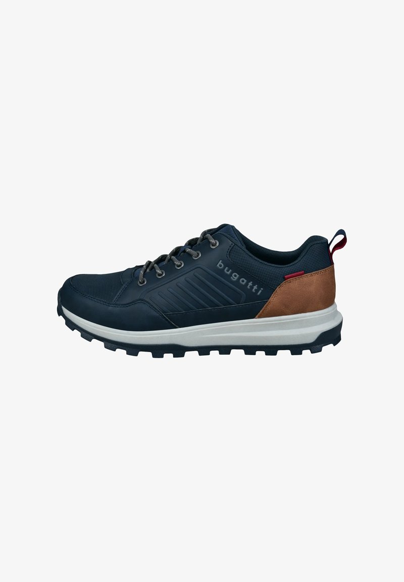Navy blue athletic shoe with textured fabric and leather accents, silver eyelets, and a rugged black sole. Features a red pull tab at the back.