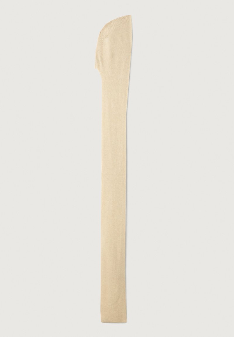 Collant alti color beige chiaro con una superficie liscia, punta arrotondata e una sottile fascia nella parte superiore, progettati per una vestibilità aderente.