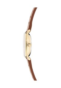 Boîtier de montre doré avec un cadran en cristal transparent, bracelet en cuir brun et finition texturée. Dispose d'une forme ronde et d'une couronne proéminente.