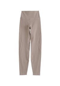 Beige leggings gemaakt van rekbaar materiaal, met een brede tailleband en naaddetails langs de benen, ontworpen voor comfort en flexibiliteit.