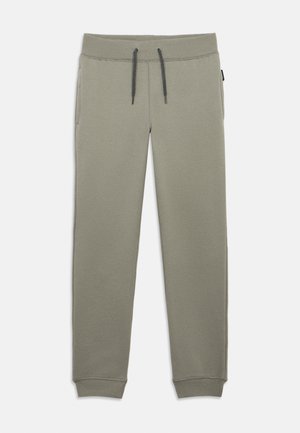 Pantalones jogger de algodón gris con cintura elástica, detalle de cordón y bolsillos laterales. Presentan puños acanalados en los tobillos.