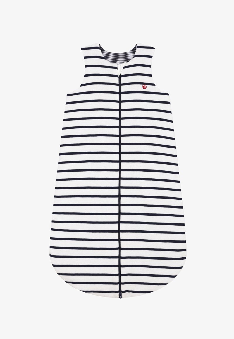 Striped sleeveless dress in white and navy, featuring a front zipper and rounded hem. Made from soft fabric with a casual design.