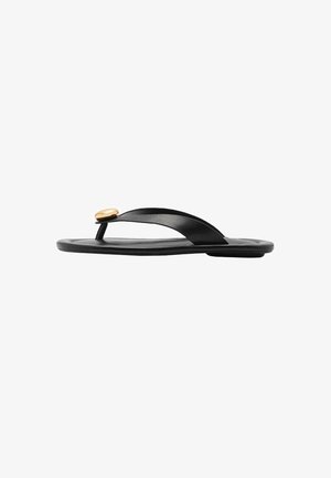 Black flip-flop featuring a smooth rubber sole and flat, flexible straps with a gold circular accent at the junction.