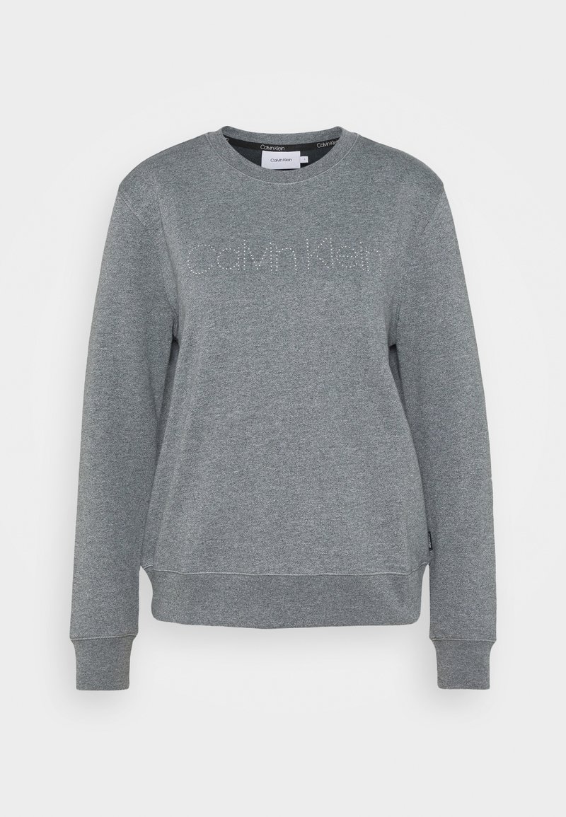 Sweat-shirt gris à manches longues avec col rond, logo "Calvin Klein" en petits strass sur la poitrine, poignets et ourlet côtelés.